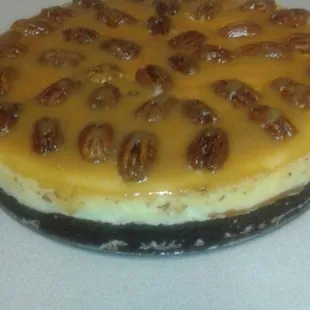 a cheesecake with pecans