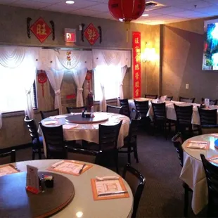 a dining room with tables and chairs