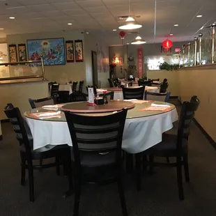 a dining area with tables and chairs