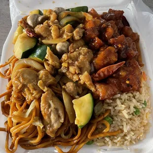 a take out container with noodles and meat