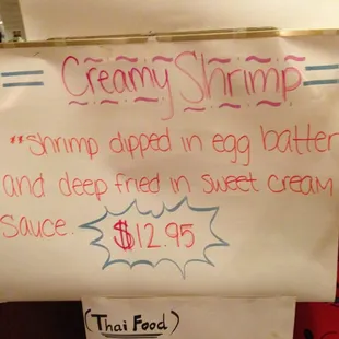 a sign for a creamy shrimp