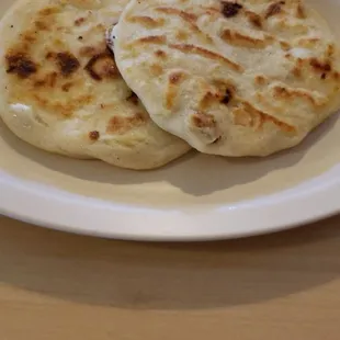 Pupusas about to be loved with cabbage mix