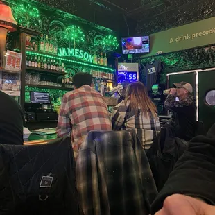 people sitting at a bar