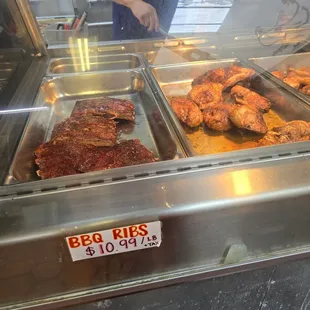 a variety of meats in a display case