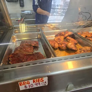a man standing in front of a display case