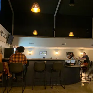 people sitting at the bar