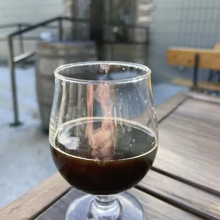 a glass of beer on a table