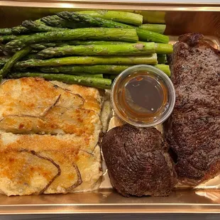 steak, asparagus, and potatoes