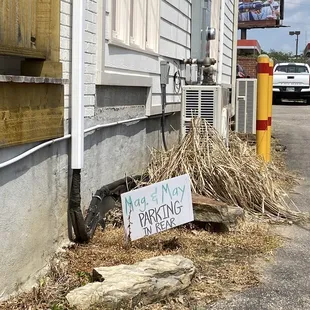 Sign to the parking in the back
