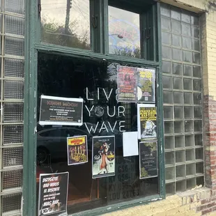 a window with posters on it