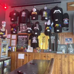 t - shirts hanging on the wall