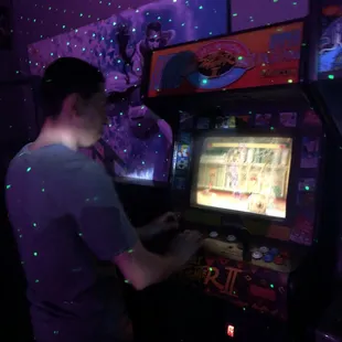 My friend playing old school video games