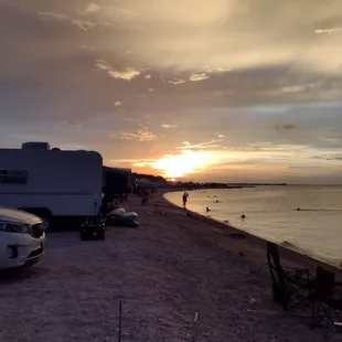 Sunset, campers, oyster bed shoreline
