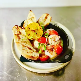 a plate of grilled vegetables and bread