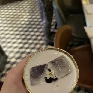 a person holding a drink