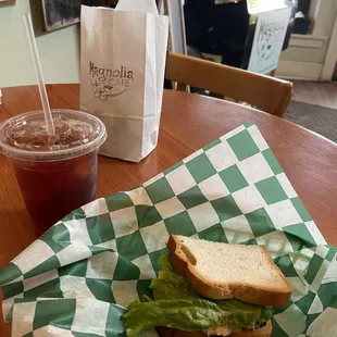 Enjoying a yummy chicken salad and an iced tea with some desserts to go!