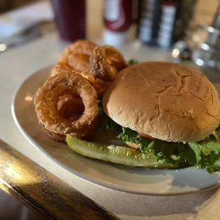 Blackened chicken sandwich with onion rings