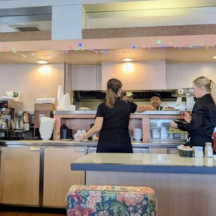 Bar seating and kitchen area