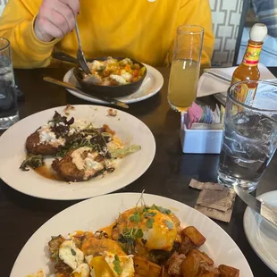 Fried green tomato&apos;s, pork belly hash, and their special crab cake eggs benedict