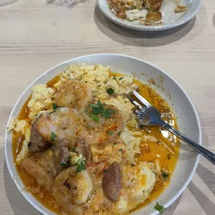 Shrimp and not so flavorful grits and oil.