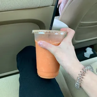 Small strawberry smoothie blended with orange juice!