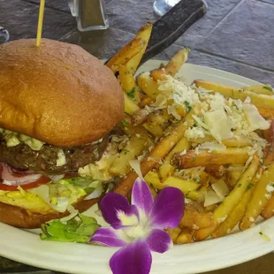 Magnolia Point Grill Burger, with grass fed, in house ground beef. Garlic parmesan fries, and a flower :). $9.50. Very good.