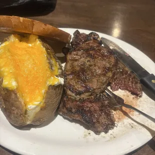 Amazing mid rare steak and baked potato!!!