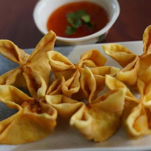 8. Crab Puffs
 Deep-fried wonton filled with imitation crab, cream cheese, onion and carrot. Served with homemade plum sauce.