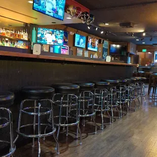 bar seating and televisions