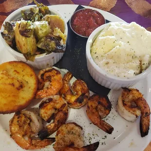 Grilled Gulf shrimp, glazed brussel sprouts, and cheese grits.