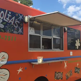 a food truck parked in a field