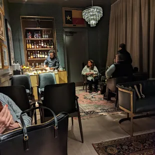 a group of people sitting at a bar