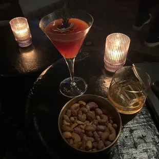 Curated passionfruit cocktail and Basil Hayden on a large ice cube.