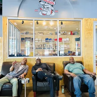 three men sitting in recliners