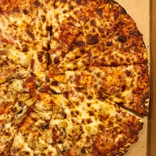 Large cheese pizza (half with mushrooms and pineapple)