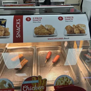 a display of chicken and carrots
