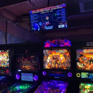 a row of pinball machines