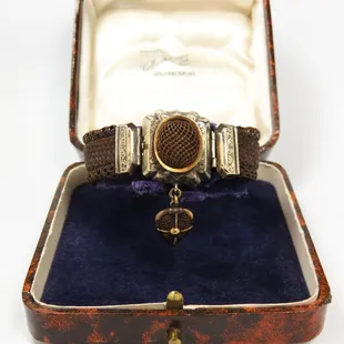 Rare antique Victorian plaited hair memorial bracelet with 14 karat gold findings.