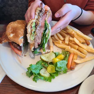 Avocado bacon cheeseburger with fries