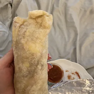 Breakfast in bed  ham and bacon burrito. Very good!