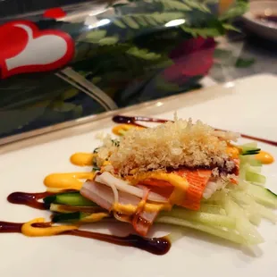Complimentary crab and cucumber salad, with Valentine's single rose bouquet in background