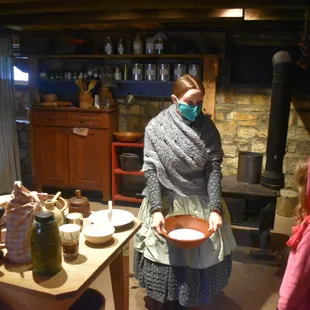 Staff members in period clothing engage visitors to help them understand what life was like in Kansas during the 1860s.