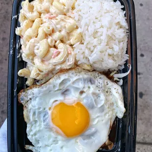 a fried egg and macaroni salad