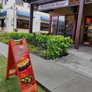 Sidewalk sign in front of the business