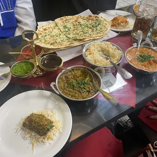 Saag paneer, butter chicken, chicken tikka masala, and garlic naan