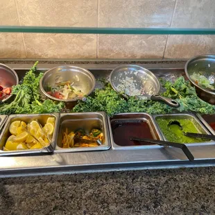 a variety of salads and condiments