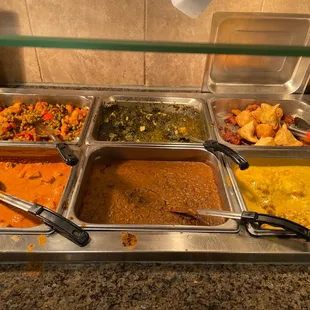 a variety of food in a buffet