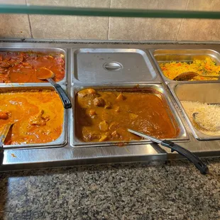 a variety of curry dishes