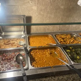 Chana Masala and other vegetables alongside dessert