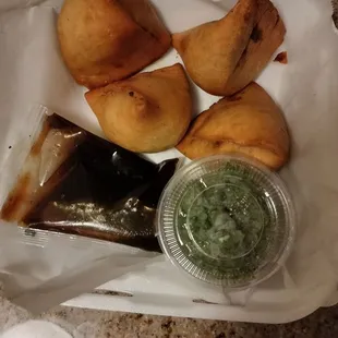 Samosa are really good and the green sauce is delicious. Well done